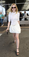 Elle-Fanning-in-White-Dress-at-Nice-Airport--03.jpg
