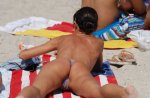 33-Beach-voyeur-caught-this-pretty-lady-tanning-her-butt.jpg