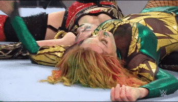 Becky_Lynch_getting_her_Tits_grabbed_by_Assuka_on_RAW_the_04.gif